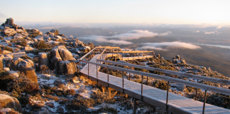 The Absolute Best 7 Things to do for Free in Hobart A wooden path cuts through rocks, at the top of Mount Wellington. Climb up the top to experience Hobart like a local.