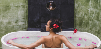 Relax in the Best Luxe Outdoor Baths in Tasmania Lady relaxing in an outdoor bath in Tasmania