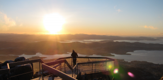 One day in Hobart? We’ve got you covered. A lady standing on Mount Wellington, one of many things to do if you have one day in Hobart